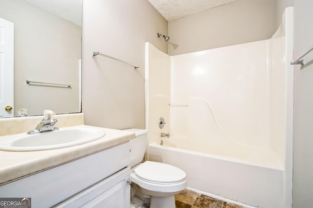 full bathroom with a textured ceiling, toilet, vanity, and shower / washtub combination