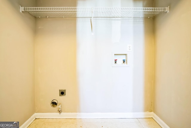 washroom featuring hookup for a gas dryer, tile patterned floors, hookup for a washing machine, and electric dryer hookup