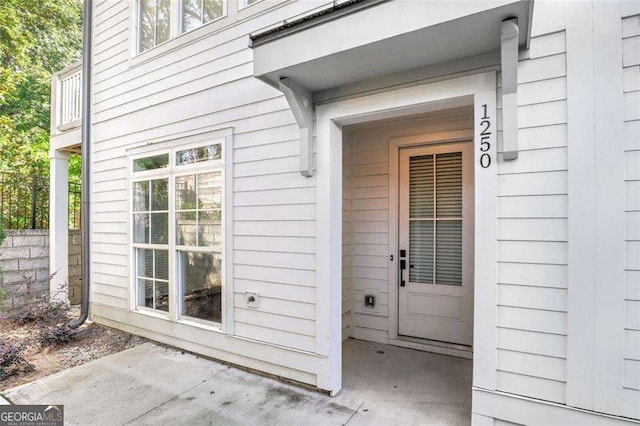 property entrance featuring a patio