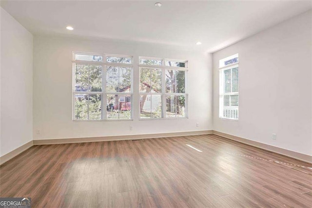 unfurnished room featuring wood-type flooring