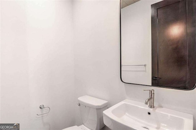 bathroom with toilet and sink