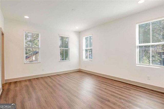 empty room featuring hardwood / wood-style floors