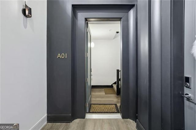 corridor featuring light hardwood / wood-style floors