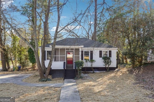 view of front of house with a sunroom