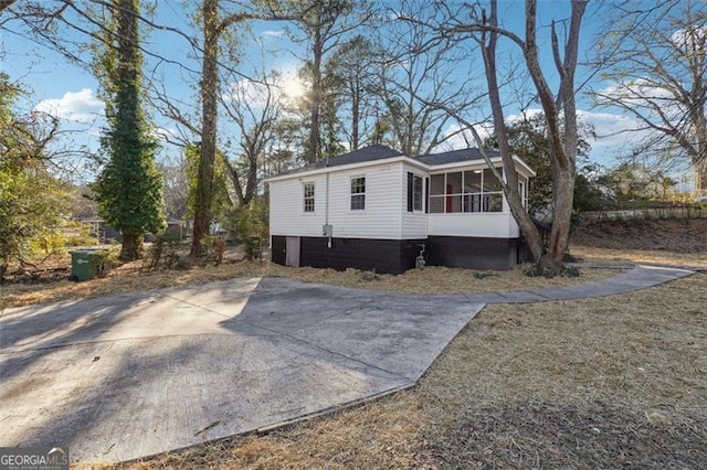 view of front of property featuring a sunroom