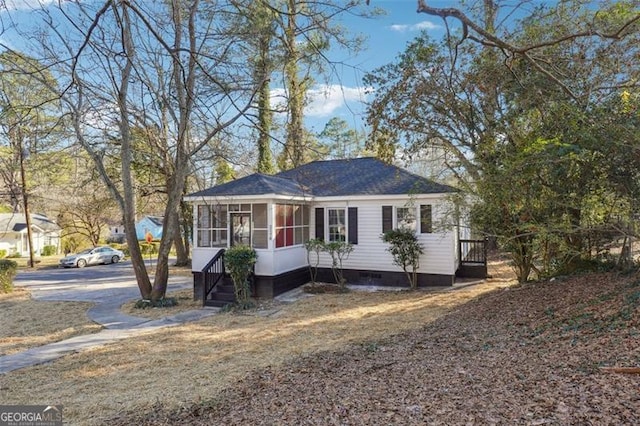 view of front of property featuring a sunroom