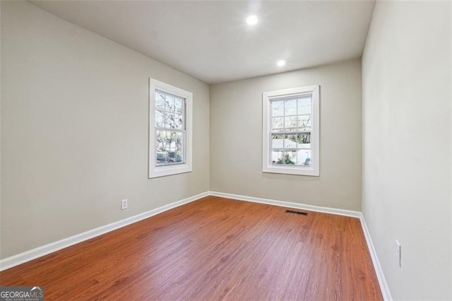 empty room featuring hardwood / wood-style flooring