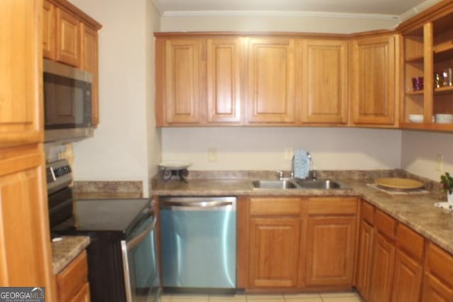 kitchen with stainless steel appliances, ornamental molding, light stone counters, and sink