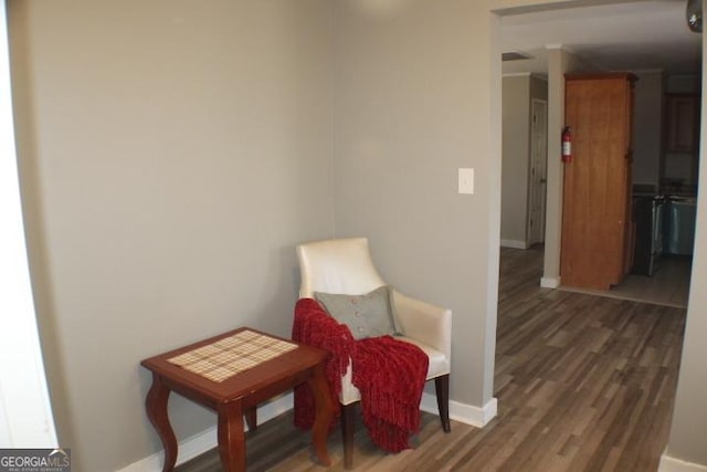 sitting room featuring dark hardwood / wood-style floors