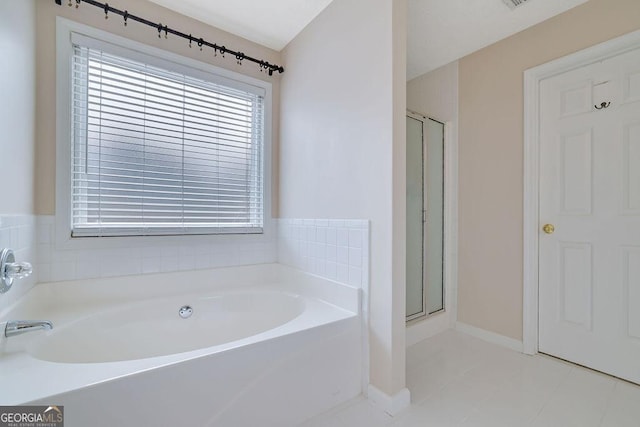 bathroom featuring independent shower and bath and tile patterned floors