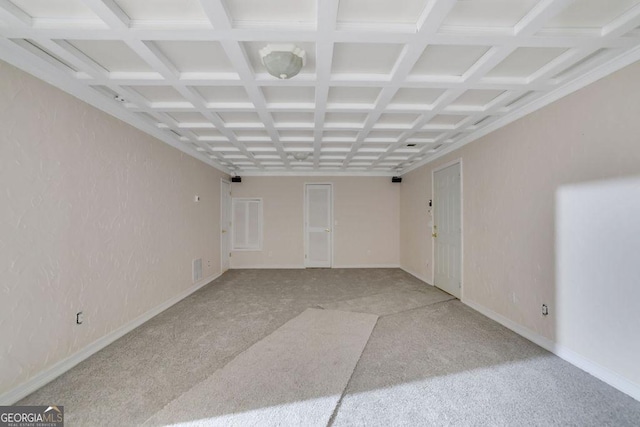 carpeted spare room with coffered ceiling and beamed ceiling