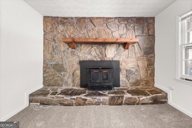 room details featuring carpet and a textured ceiling