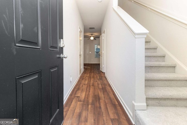 corridor with dark wood-type flooring