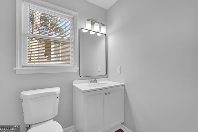 bathroom with toilet and vanity