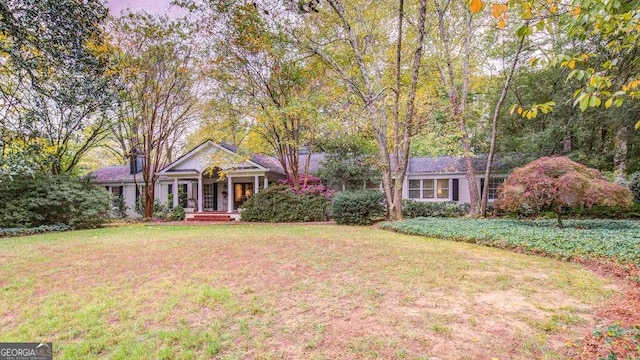 ranch-style home with a front yard