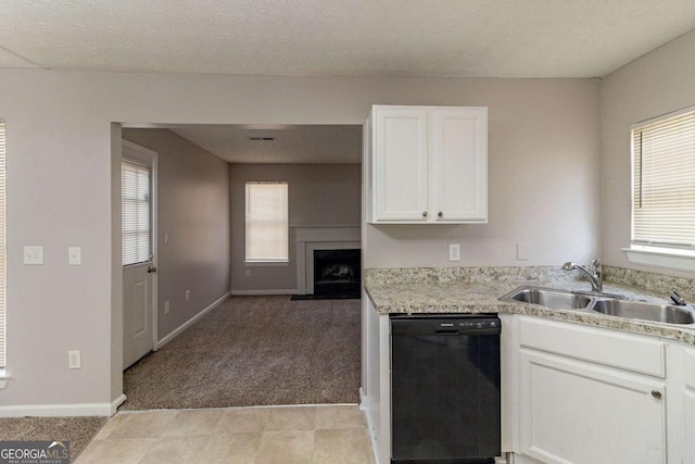 kitchen with light carpet, black dishwasher, a textured ceiling, white cabinets, and sink