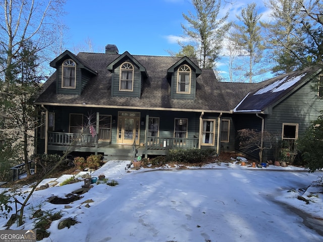 new england style home featuring covered porch