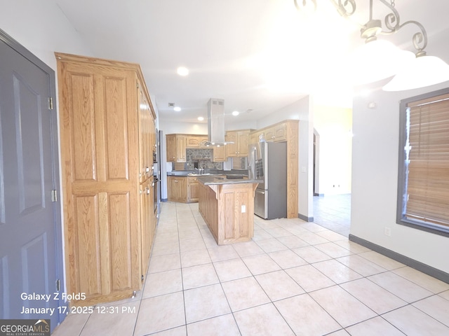 kitchen with light tile patterned floors, a kitchen bar, stainless steel fridge, a kitchen island, and pendant lighting