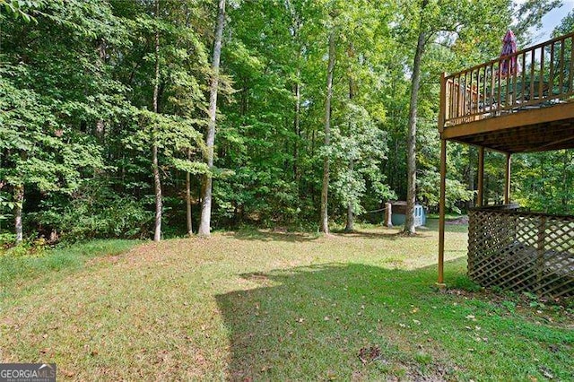 view of yard with a wooden deck