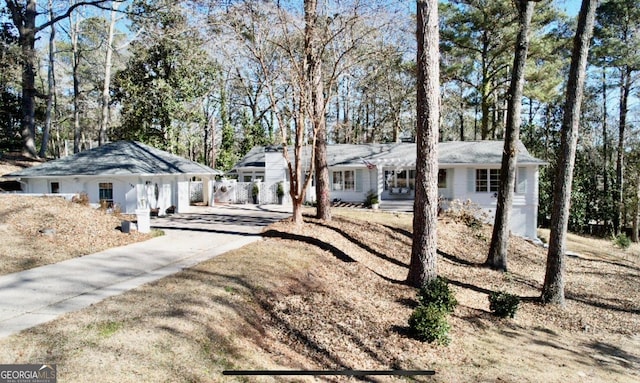 ranch-style house featuring a carport