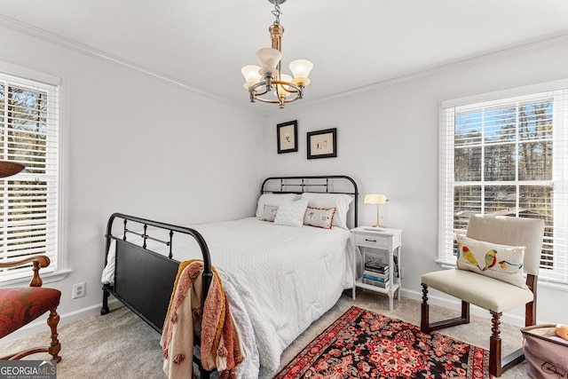 bedroom with carpet, a chandelier, and ornamental molding