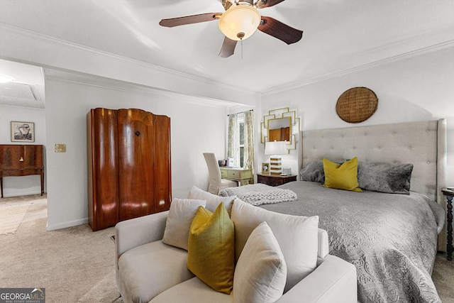 carpeted bedroom with ceiling fan and crown molding