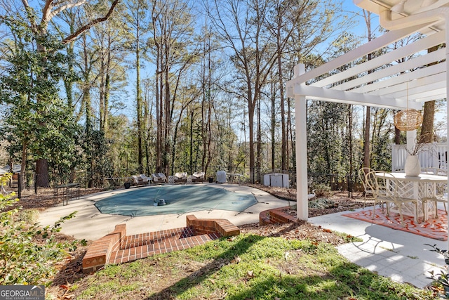 view of swimming pool featuring a pergola and a patio area