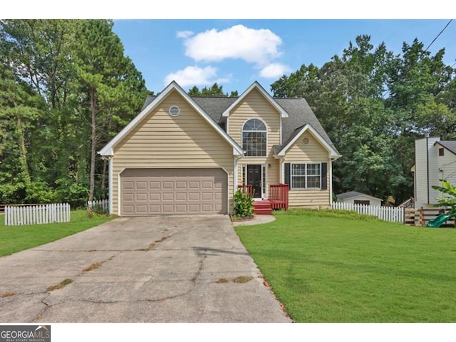 view of front of house with a garage and a front yard