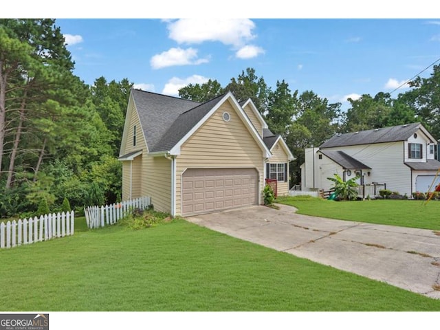 view of front of property with a front lawn and a garage