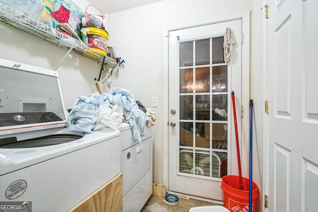 washroom with washer and dryer