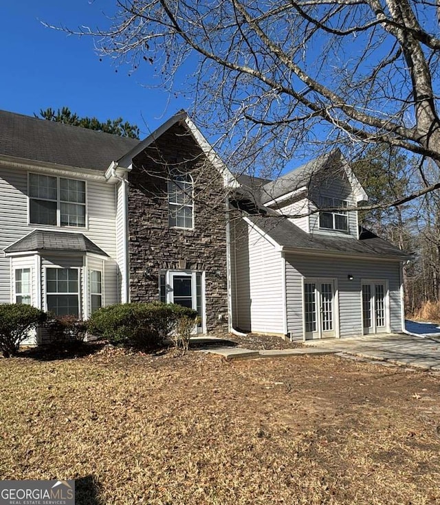 view of side of home featuring a patio