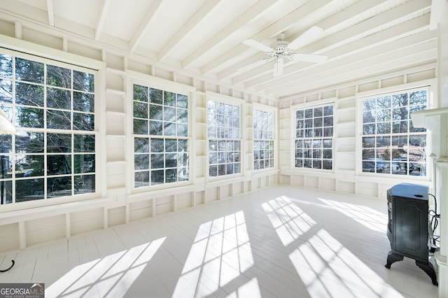 unfurnished sunroom with ceiling fan