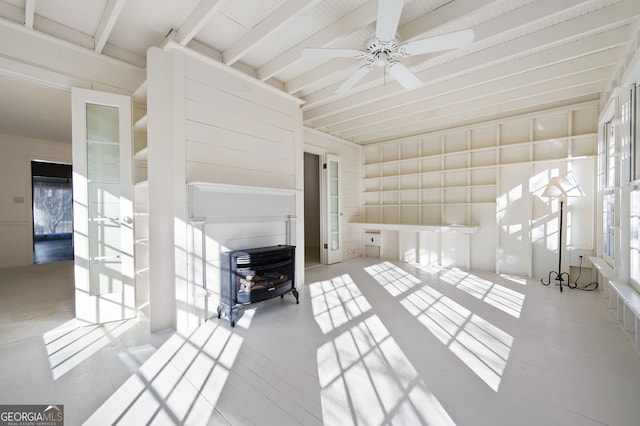 interior space featuring ceiling fan and beam ceiling