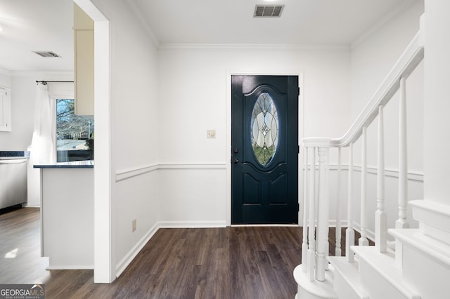 entrance foyer with dark wood-type flooring and ornamental molding