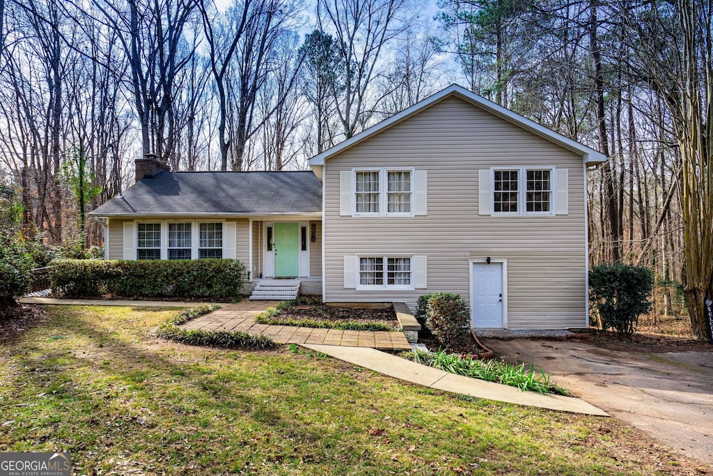 split level home with a front yard