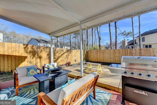 view of patio / terrace featuring an outdoor living space, a grill, and a deck