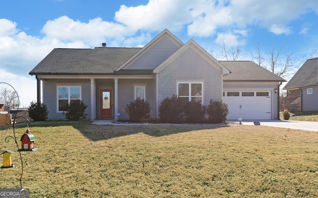 view of front of property with a garage and a front lawn