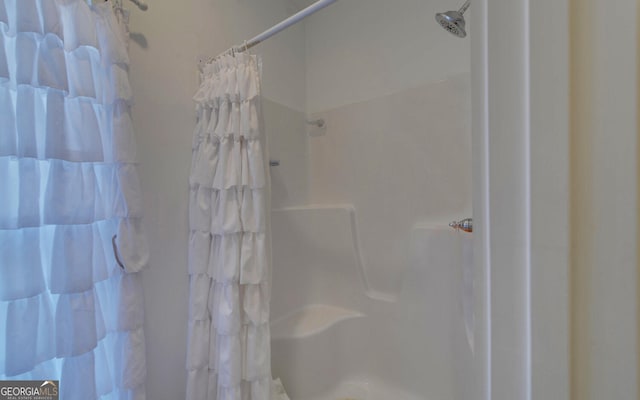 bathroom featuring walk in shower