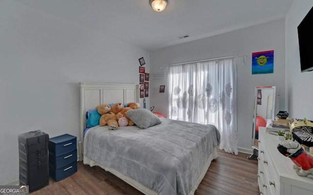 bedroom featuring dark hardwood / wood-style floors