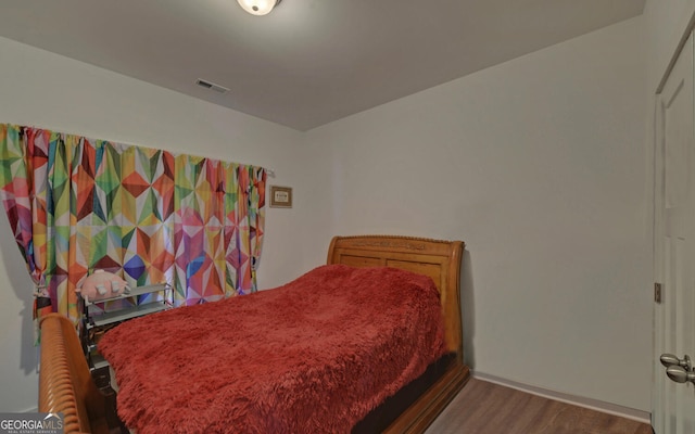 bedroom featuring hardwood / wood-style floors