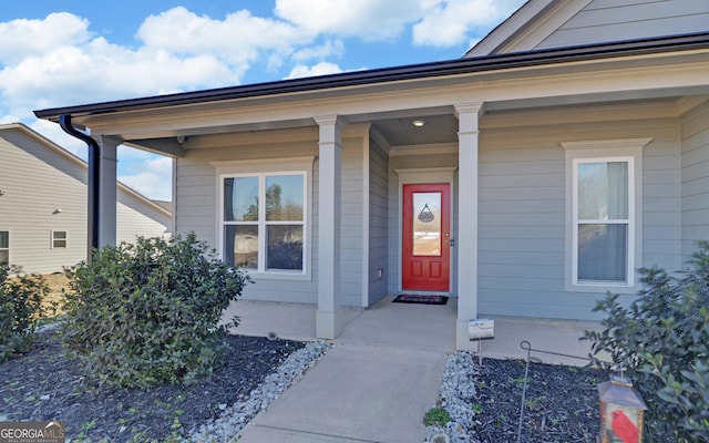 doorway to property featuring covered porch