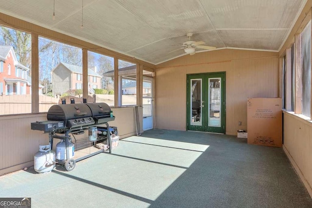 sunroom featuring lofted ceiling and ceiling fan