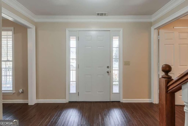 entrance foyer with a healthy amount of sunlight and ornamental molding