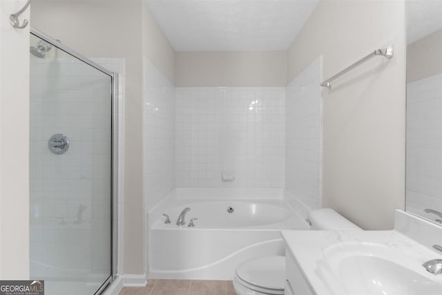 full bathroom with toilet, vanity, tile patterned flooring, a textured ceiling, and shower with separate bathtub