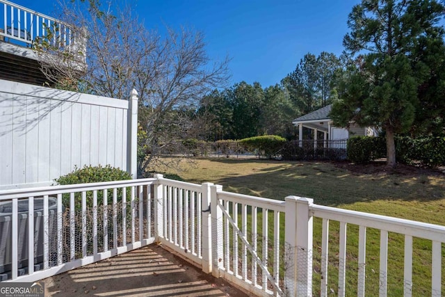 wooden terrace with central AC and a yard