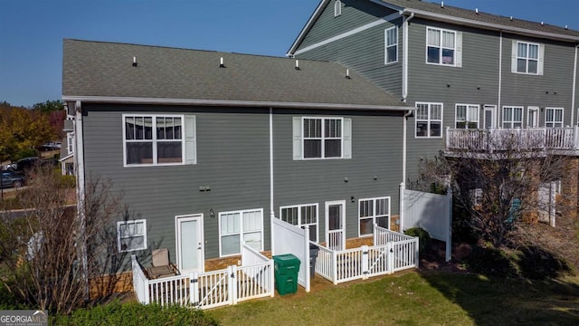 rear view of house with a yard