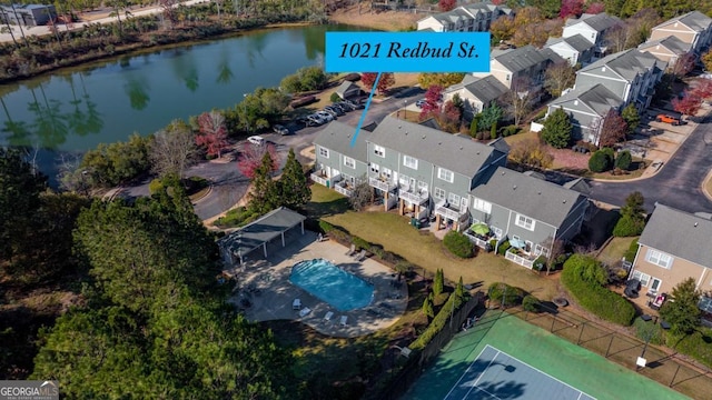 birds eye view of property with a water view