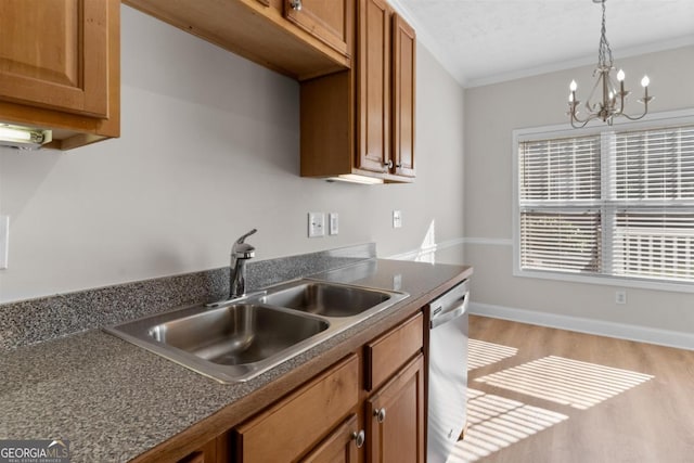 kitchen with stainless steel dishwasher, sink, crown molding, an inviting chandelier, and light hardwood / wood-style flooring