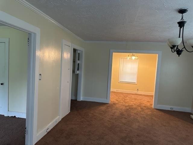 interior space featuring carpet floors, an inviting chandelier, and a textured ceiling