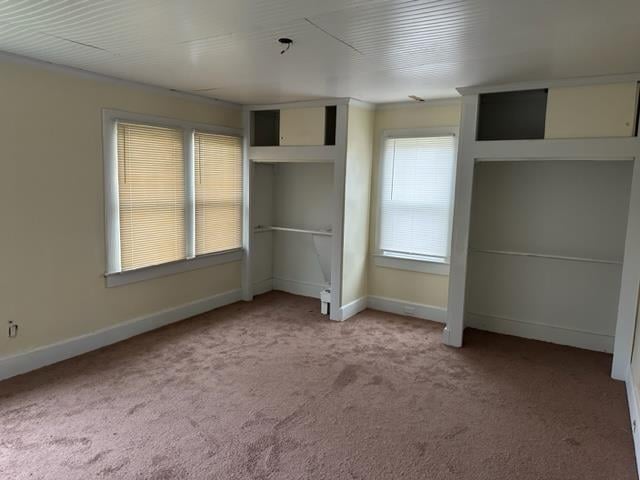 unfurnished bedroom with light carpet